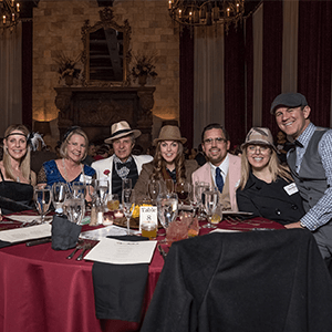 Lansing Murder Mystery party guests at the table
